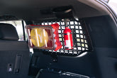 Toolkit and extinguisher on the 2024 Toyota Land Cruiser Rear Window Molle Storage Panels