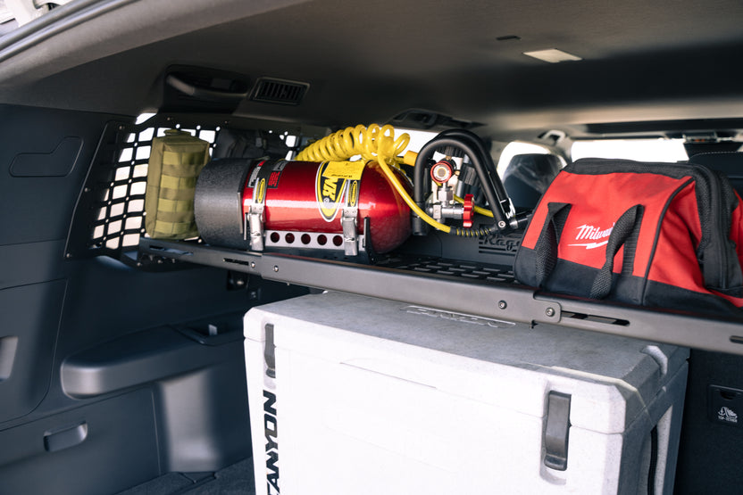 Seat upright with the Molle Panel Storage Shelf for the 2024 Toyota Land Cruiser