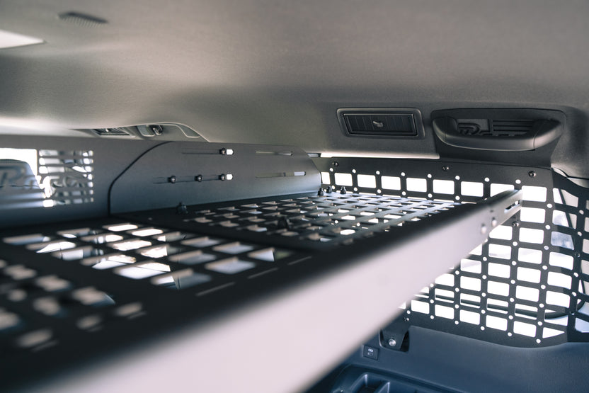 Seats reclined with the Molle Panel Storage Shelf for the 2024 Toyota Land Cruiser