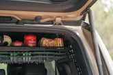 Camping foodstuff placed on the molle shelf for safe-keeping. 