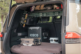 Tools and food mounted to the molle panel windows and shelf to make room for heavier camping cooler and stove in the cargo area.