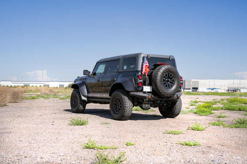 Universal Clevis Mounted Whip Flag Holder installed on Bronco with flag