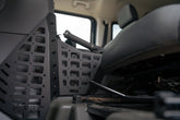 Center Console Molle Panels for the 2022-2026 INEOS Grenadier & Quartermaster, photographed with the seat fully back.