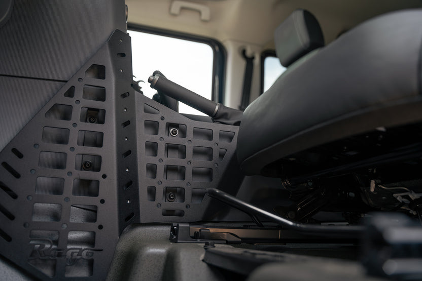 Center Console Molle Panels for the 2022-2026 INEOS Grenadier & Quartermaster, photographed with the seat fully back.