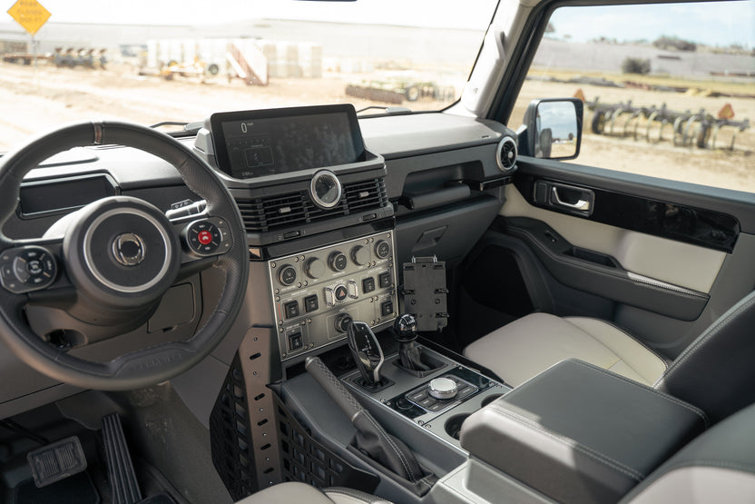 Driver view with phone mount on the Center Console Molle Panels for the 2022-2026 INEOS Grenadier & Quartermaster