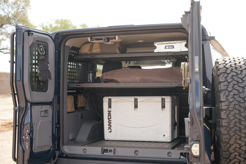 Driver side 2022-2026 INEOS Grenadier Rear Door Window Molle Panel with gloves attached to be easily accessible.